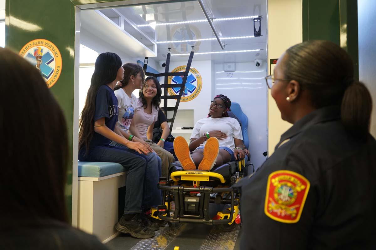 Girl Scouts sitting in ambulance